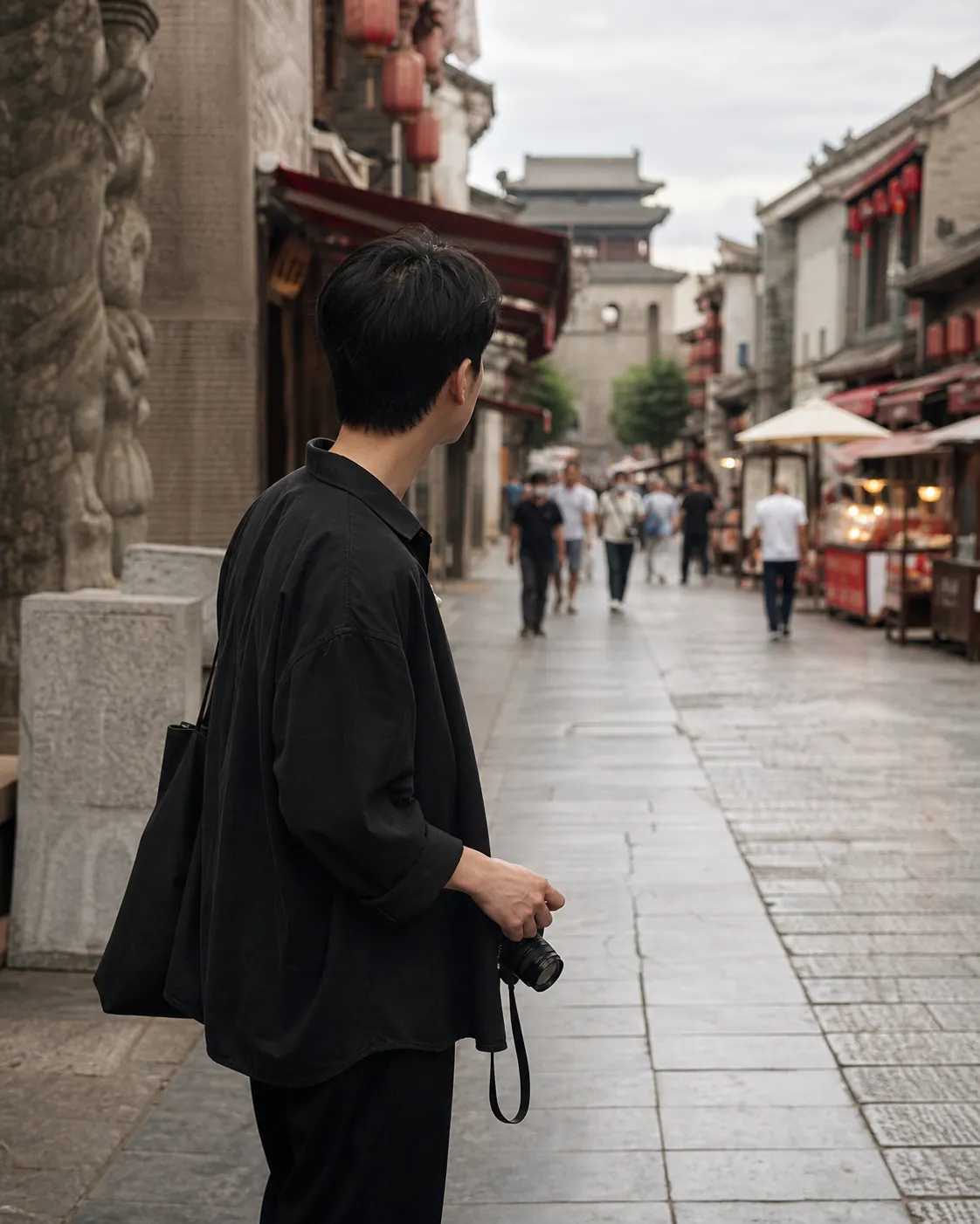 A Xi'an-based designer walking through an old city food street